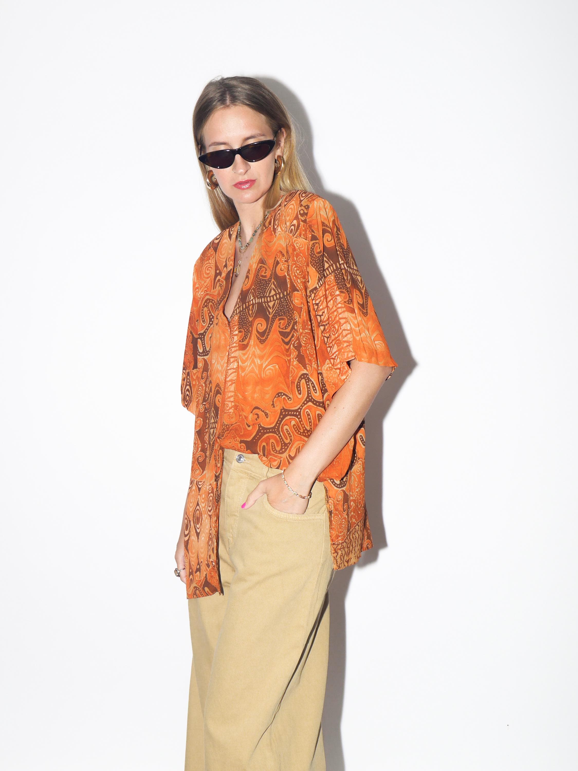 VINTAGE Viscose Orange Abstract Oversized Short Sleeve Blouse With Opalescent Buttons And Shoulder Pads From The 1980s By Domino